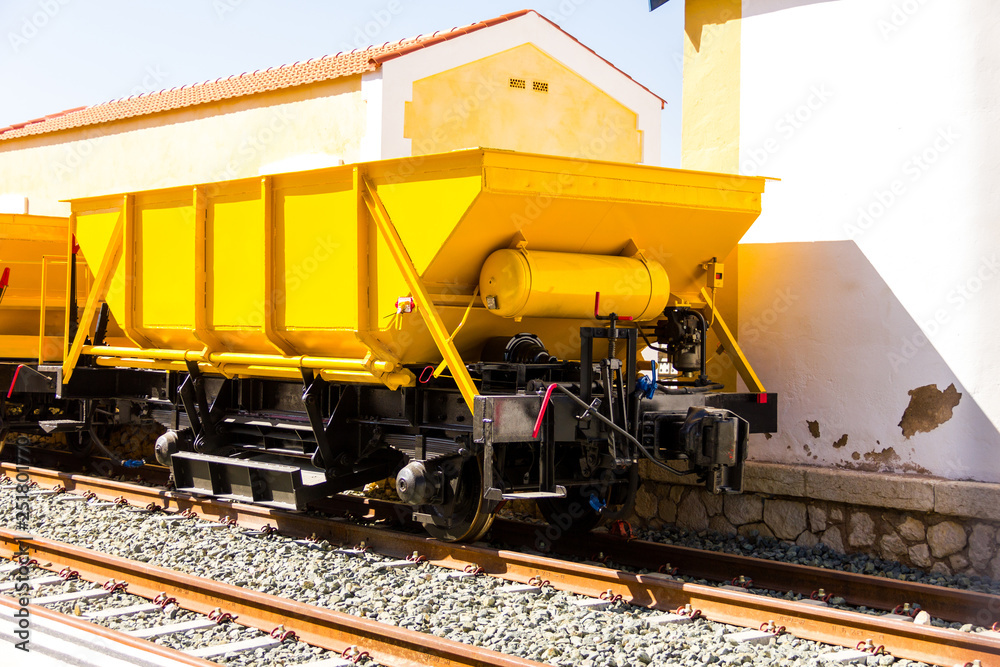 Ballast train. A large cargo yellow train at the station Ballast train. A large cargo yellow train at the station