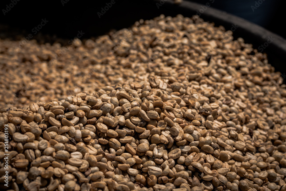 Many raw coffee beans are waiting to be cooked. Many raw coffee beans are waiting to be cooked.