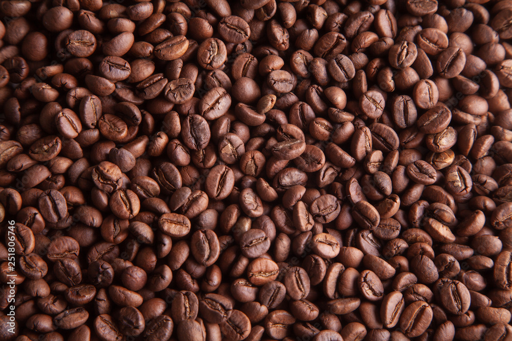 Whole grains of natural roasted coffee for the background. Whole grains of natural roasted coffee for the background.