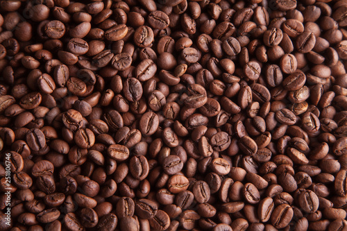 Whole grains of natural roasted coffee for the background.