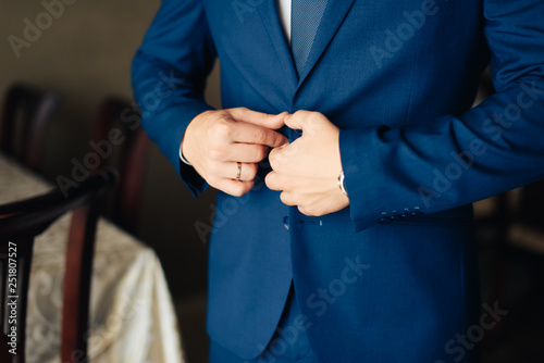 the groom in a wedding suit  a man preparing for the wedding 1