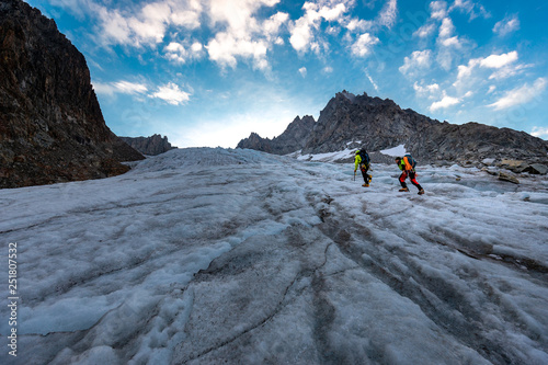 Mountaineer climbing glacier Mont Blanc mountains, France Alps.