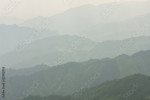 Landscape layers mountains in haze