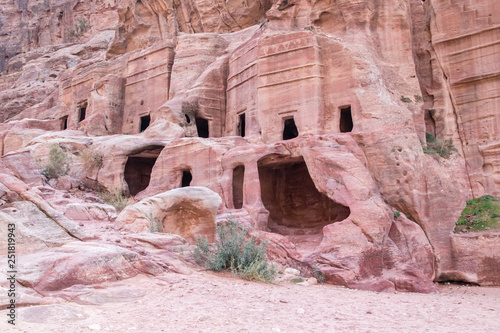 View of cave at street of facades in Petra (Red Rose City), Jordan. Petra is UNESCO World Heritage Site and is one of New7Wonders of the World.