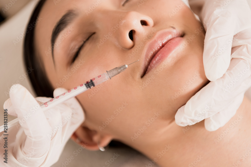 close up of beautiful asian woman getting beauty injection at clinic close up of beautiful asian woman getting beauty injection at clinic