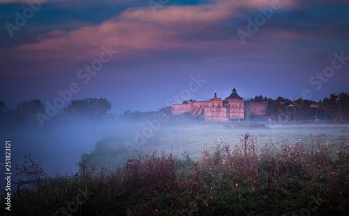 Misty morning with ancient fortress