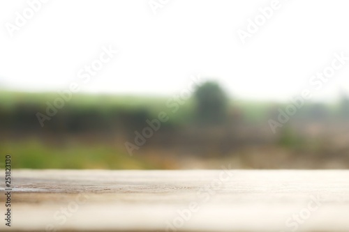 Wooden table blurred background of landscape with nature green and mountain