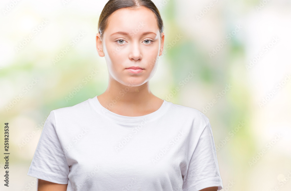 Young beautiful caucasian woman over isolated background with serious expression on face. Simple and natural looking at the camera. Young beautiful caucasian woman over isolated background with serious expression on face. Simple and natural looking at the camera.