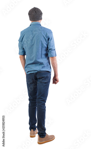 Back view of man in dark jeans. Standing young guy. Rear view people collection. backside view of person. Isolated over white background.