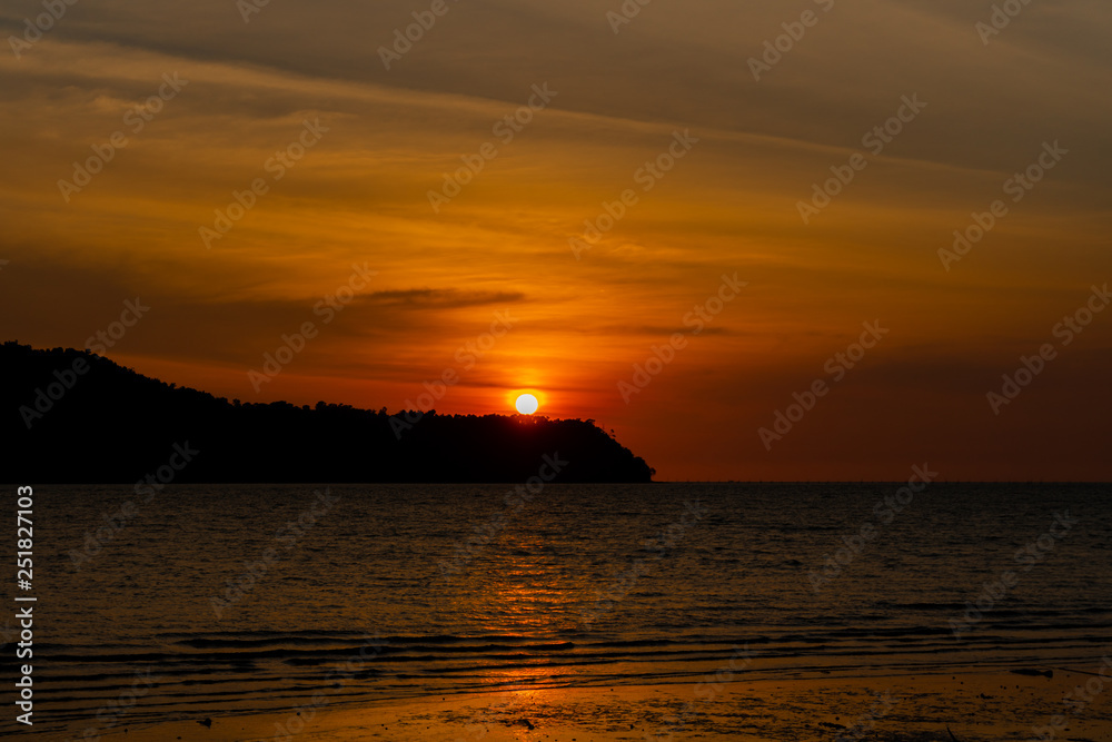 silhouette of an island against beautiful sunset at Tanjung Dawai, Kedah, Malaysia
