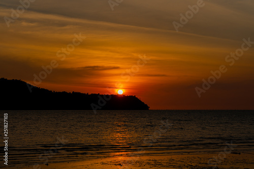 silhouette of an island against beautiful sunset at Tanjung Dawai, Kedah, Malaysia photo