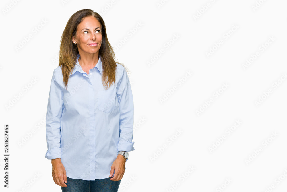 Beautiful middle age business adult woman over isolated background smiling looking side and staring away thinking. Beautiful middle age business adult woman over isolated background smiling looking side and staring away thinking.