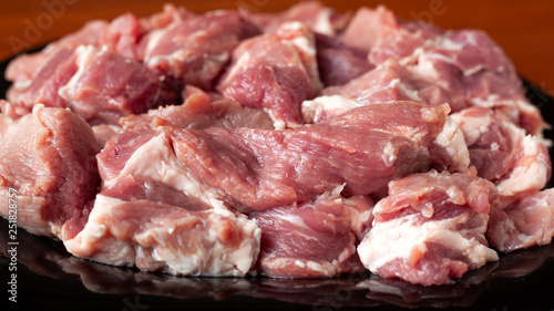 fresh raw meat of pork neck with streaks of fat, ready for marinating and cooking kebabs