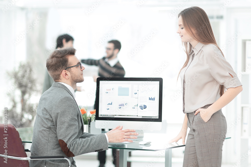 two employees of the company discussing financial data two employees of the company discussing financial data