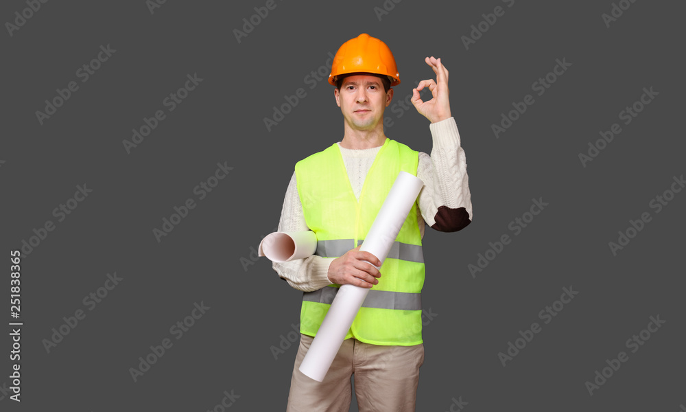 the civil engineer in a helmet shows gesture - OK, everything is good the civil engineer in a helmet shows gesture - OK, everything is good