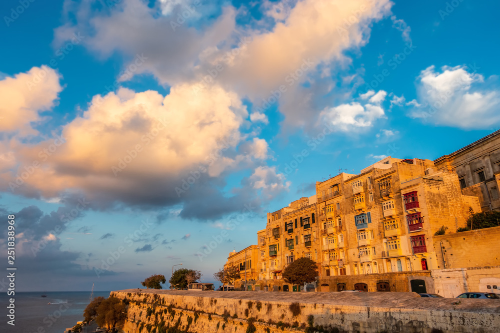 beautiful view of european city Valletta with seafront and blue sky with clouds in sundown, Malta