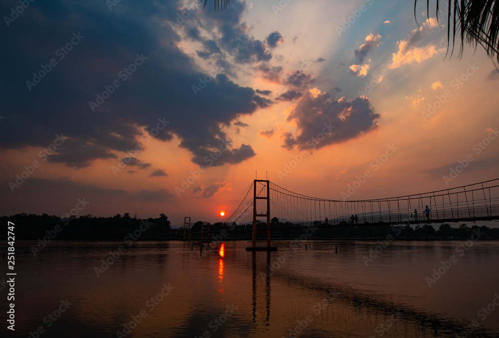 Evening sun light Splash through the clouds over the river Evening sun light Splash through the clouds over the river