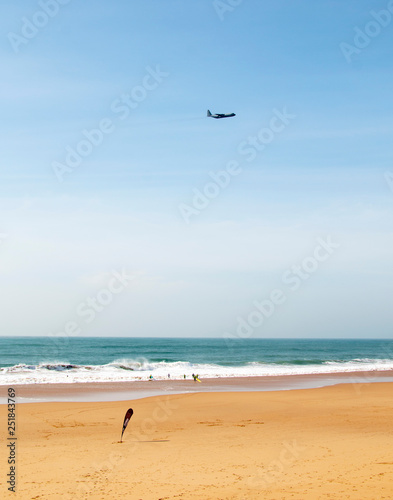 afternoon military aircraft flies over the ocean
