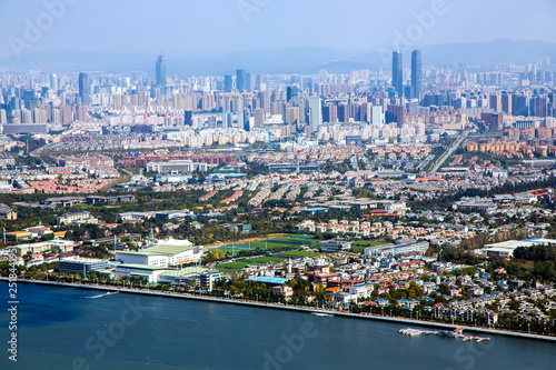 Top view of the modern multi-million city of Kunming  China. Kunming is capital of Yunnan province   most famous city of southwest China and southeast Asian on the shore on the north shore of Dianchi 