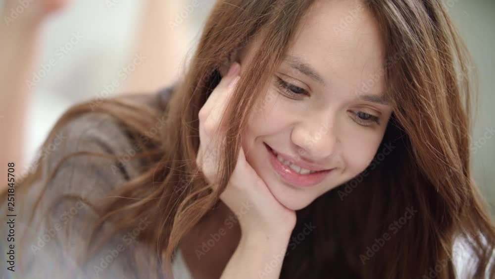 Playful woman flirting at video call online. Portrait of woman grimacing Playful woman flirting at video call online. Portrait of woman grimacing
