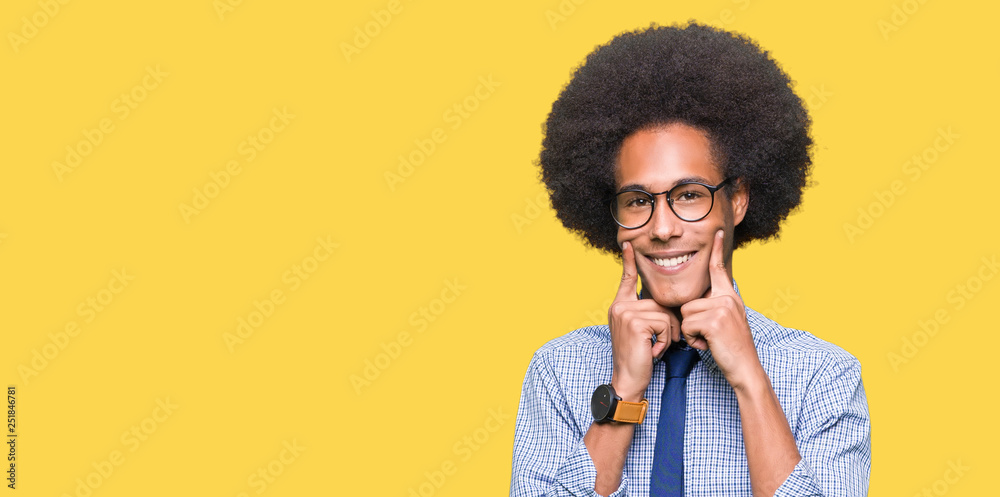 Young african american business man with afro hair wearing glasses Smiling with open mouth, fingers pointing and forcing cheerful smile