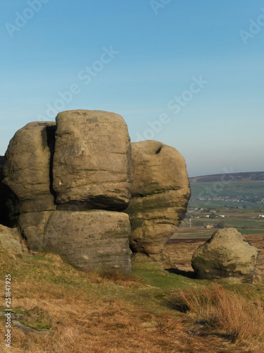 the large group of boulders at the bridestones a large group of gritstone rock formations in west yorkshire landscape near todmorden against pennine countryside © Philip J Openshaw 