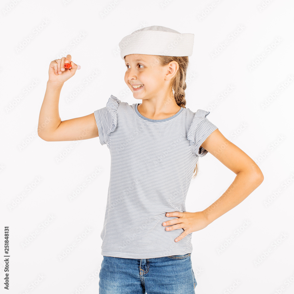 Little girl wearing a sailor costume and looking at the camera on white background. Little girl wearing a sailor costume and looking at the camera on white background.