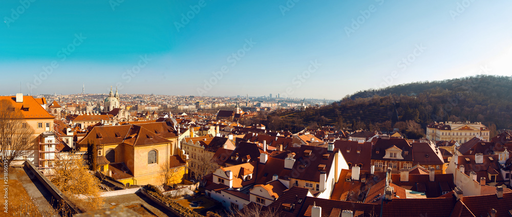Top view over red roofs and historic center of city Prague, Czech Republic. City panorama. Sunny day