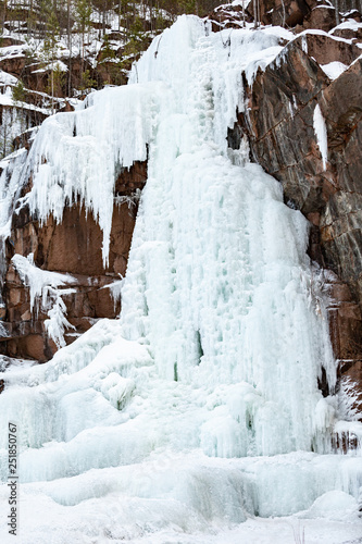 Frozen ice on rocks from a waterfall in the mountains © Restyler