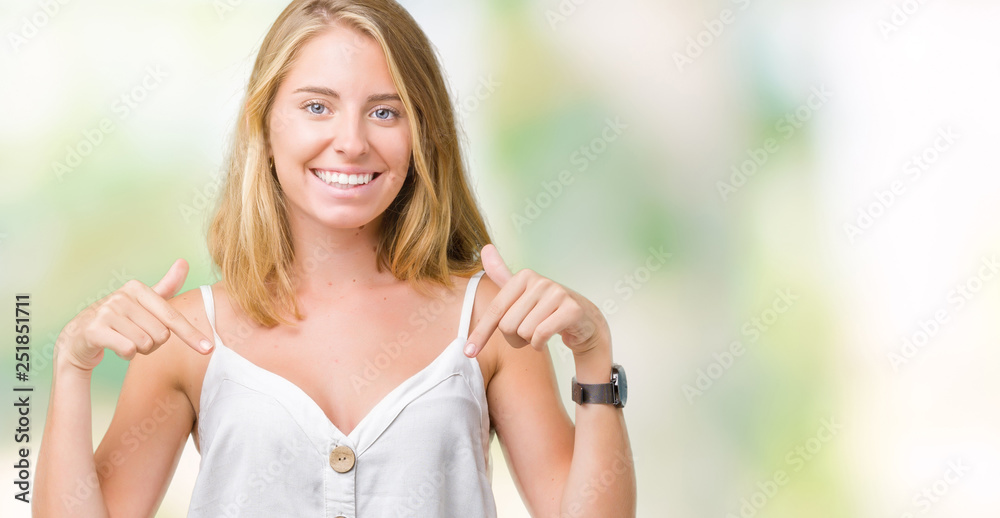 Beautiful young woman over isolated background looking confident with smile on face, pointing oneself with fingers proud and happy.
