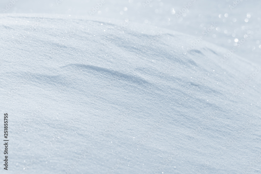 Fresh snow background texture. Winter background with snowflakes and snow mounds. Snow lumps.