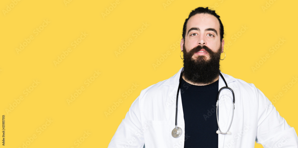 Doctor with long hair wearing medical coat and stethoscope Hands together and fingers crossed smiling relaxed and cheerful. Success and optimistic Doctor with long hair wearing medical coat and stethoscope Hands together and fingers crossed smiling relaxed and cheerful. Success and optimistic
