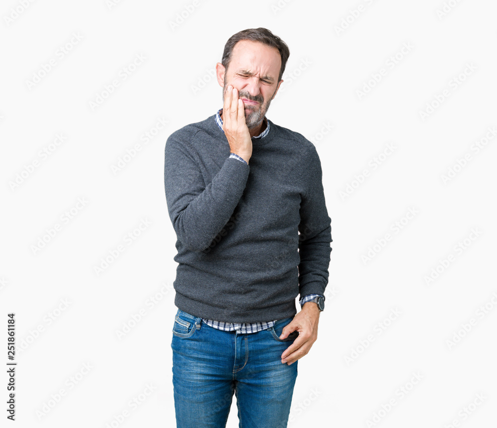 Handsome middle age senior man wearing a sweater over isolated background touching mouth with hand with painful expression because of toothache or dental illness on teeth. Dentist concept. Handsome middle age senior man wearing a sweater over isolated background touching mouth with hand with painful expression because of toothache or dental illness on teeth. Dentist concept.