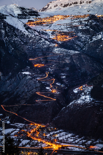 Night view of the famous road climb to Alpe d'Huez, right at the main traffic time in February, when all the tourists are coming to enjoy the ski resort.