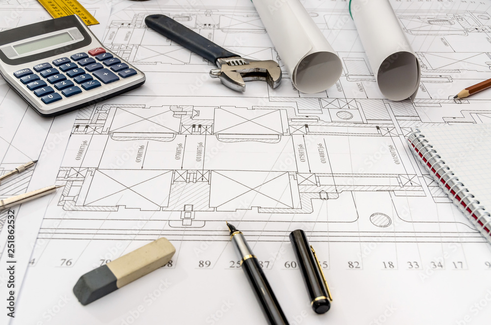 Engineer equipment on blueprint background, close up Engineer equipment on blueprint background, close up