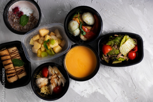 asian food into lunch boxes, mexican salad, raw vegetables,top view