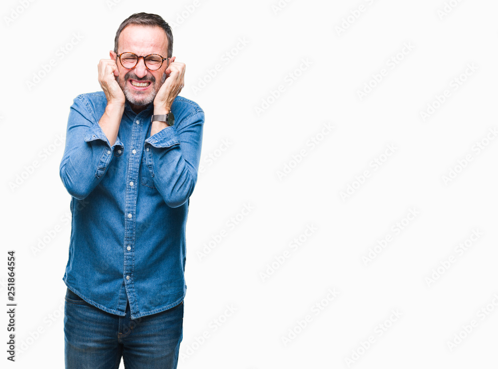 Middle age hoary senior man wearing glasses over isolated background covering ears with fingers with annoyed expression for the noise of loud music. Deaf concept. Middle age hoary senior man wearing glasses over isolated background covering ears with fingers with annoyed expression for the noise of loud music. Deaf concept.