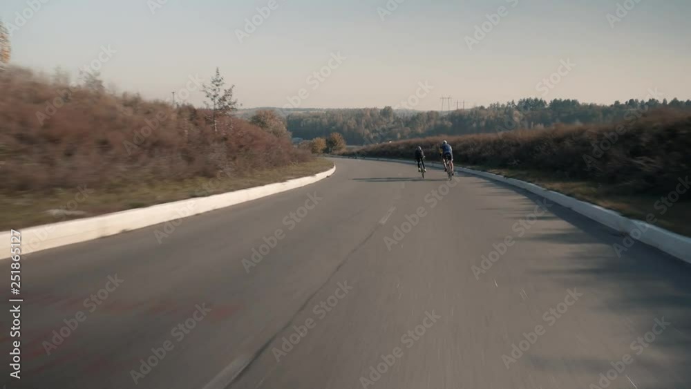 Cyclist Riding On Bicycle On Cycling Road.Cycling On Bike In City.Professional Athlete Training On Carbon Bike Cyclist Riding On Bicycle On Cycling Road.Cycling On Bike In City.Professional Athlete Training On Carbon Bike