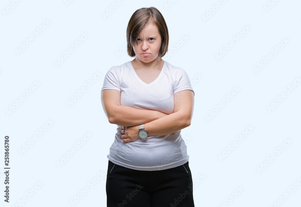 Young adult woman with down syndrome over isolated background skeptic and nervous, disapproving expression on face with crossed arms. Negative person. Young adult woman with down syndrome over isolated background skeptic and nervous, disapproving expression on face with crossed arms. Negative person.