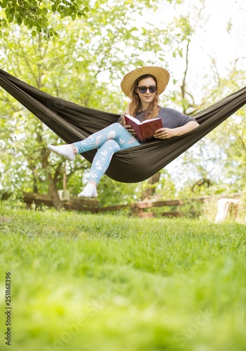 gorgeous young woman in a hammock in the nature