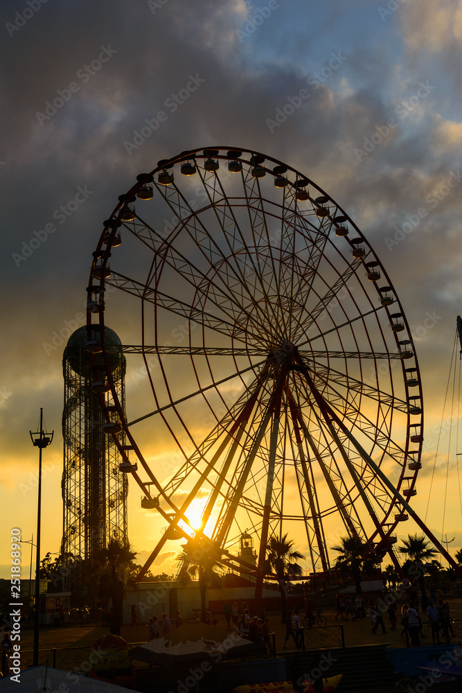 Ferris wheel on amazing sunset sky background Ferris wheel on amazing sunset sky background