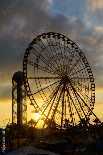 Ferris wheel on amazing sunset sky background © vahanabrahamyan