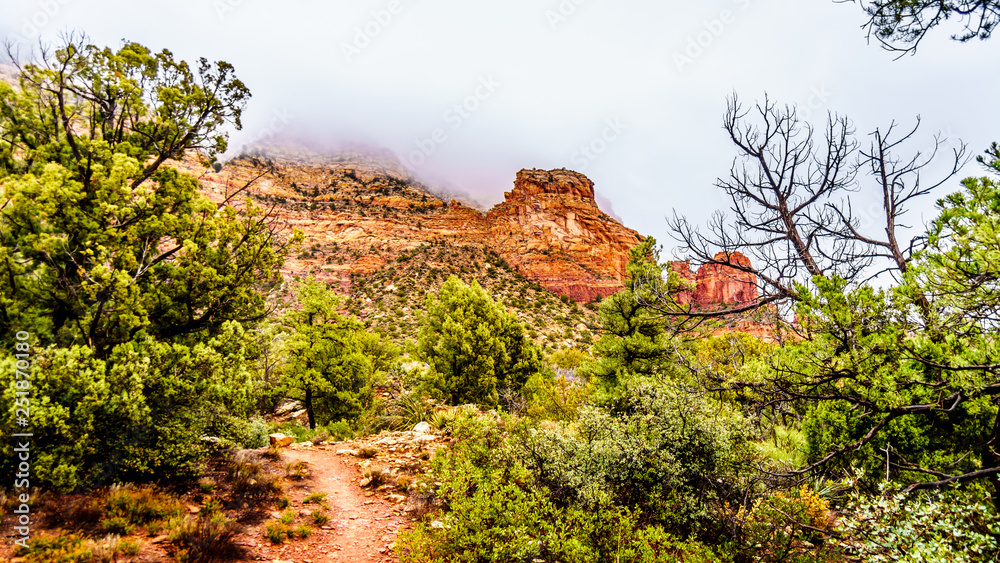 Clouds hanging over the Lower Chimney Rock Trail, a hiking trail to Chimney Rock, a sandstone butte at the town of Sedona in northern Arizona, United States of America