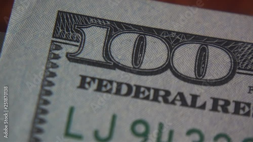Macro. Dollar bills, money background. Portrait of George Washington closeup on the bills for a hundred dollars. Dollars, money close up.