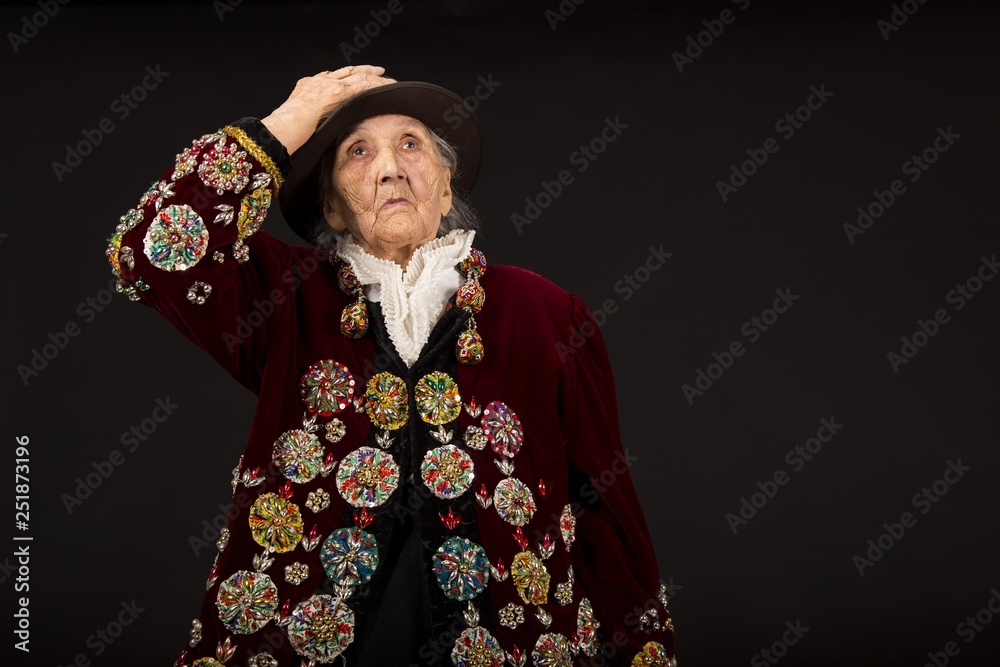 Old woman wearing a vermilion velvet jacket Old woman wearing a vermilion velvet jacket