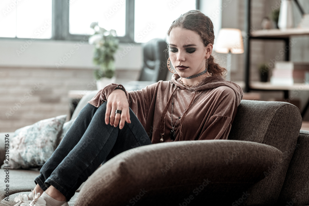 Teenager with smoky eyes wearing accessories feeling stressed Teenager with smoky eyes wearing accessories feeling stressed