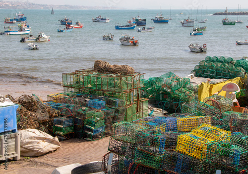 various fishing gear on the dock, near the ocean