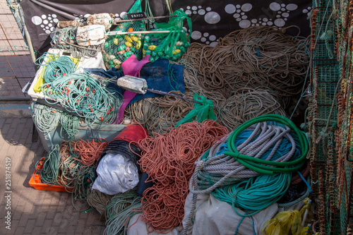 various fishing gear on the dock, near the ocean