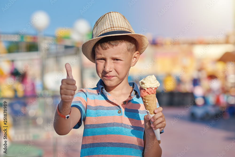 A Boy Wearing A White Shirt Is Eating Ice Cream Stock Photo