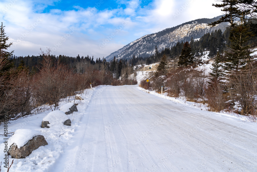 Snow and ice covered road in Banff National Park during Winter. This is Vermillion Lakes Road Snow and ice covered road in Banff National Park during Winter. This is Vermillion Lakes Road